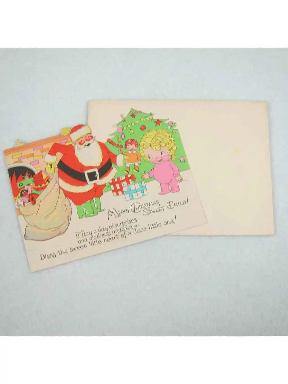 Vintage Christmas Card & Envelope Kewpie Style Girl & Santa Toys Tree Fireplace